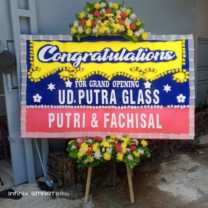 Papan bunga ucapan selamat atas grand opening